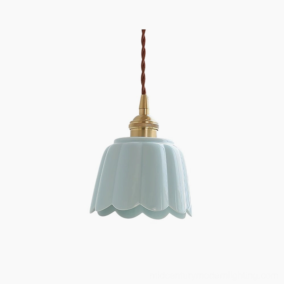 Celadon fluted ceramic pendant light with aqua blue finish and brass hardware, front studio view