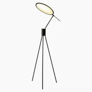 Celeste minimalist black floor lamp with circular flat shade and tripod base, front-side studio view