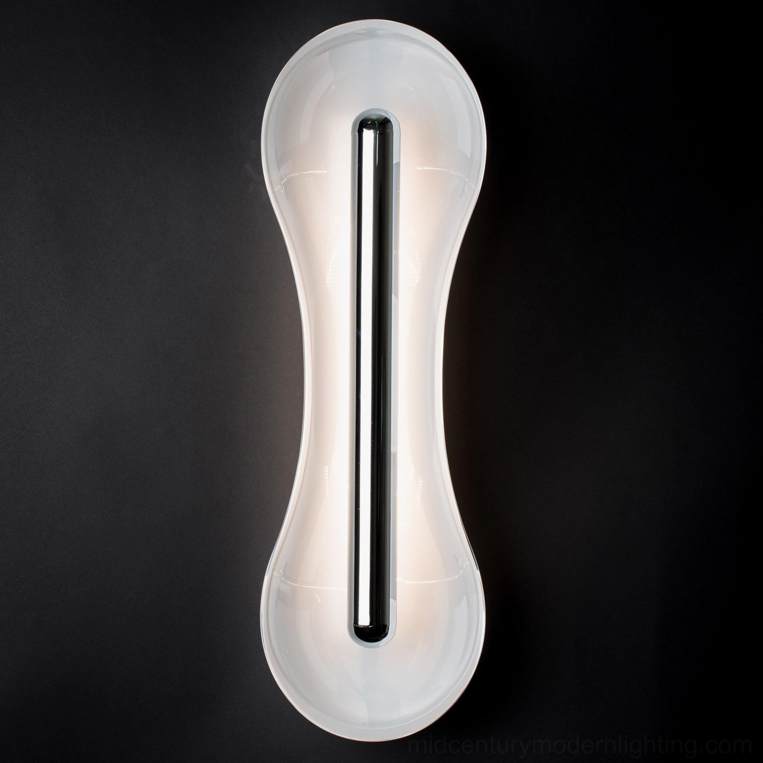 Cell Wall Lamp in Cognac glass finish on neutral wall interior design warm light color temperature demonstration