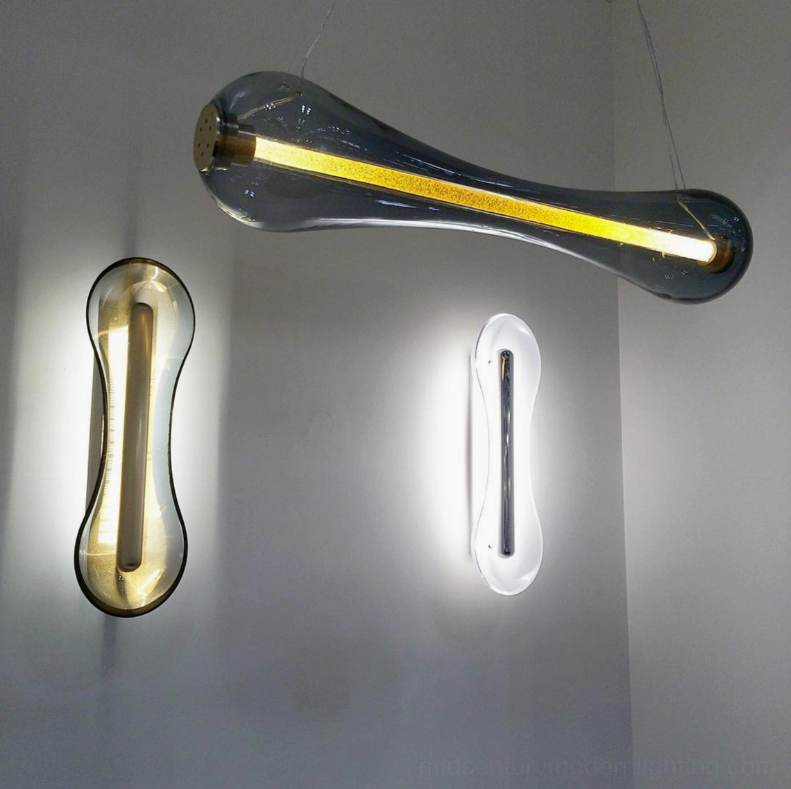 Two decorative wall lamps including Cell Wall Lamp and pendant light fixtures showing color variations in neutral interior setting
