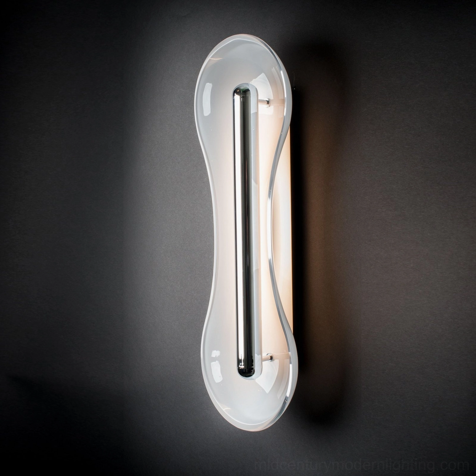 Silver finish Cell Wall Lamp with Cognac glass color option mounted on interior wall minimalist contemporary design