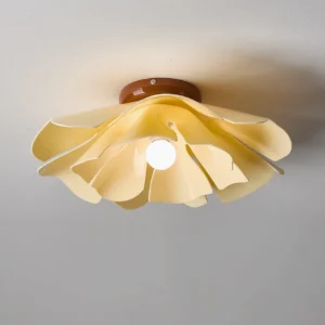 Cenia flush mount light fixture with coffee-toned metal base and acrylic petal layers, close-up detail shot