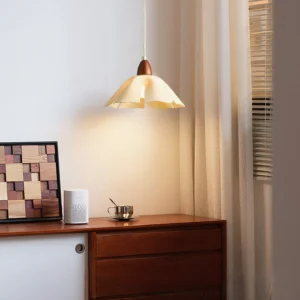 Cenia cream and walnut pendant lamp in residential dining setting with warm ambient light