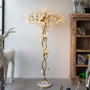 Ceramic flower brass floor lamp in vintage luxury living room with wooden cabinet and decorative silver deer statue