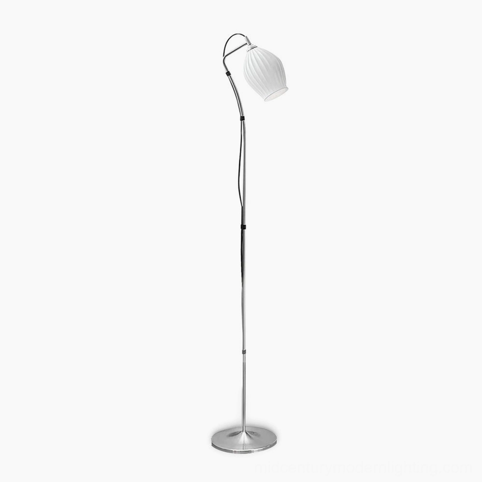 Ceramic ribbed arc floor lamp with silver metal pole and white ribbed ceramic shade, front studio view against white background