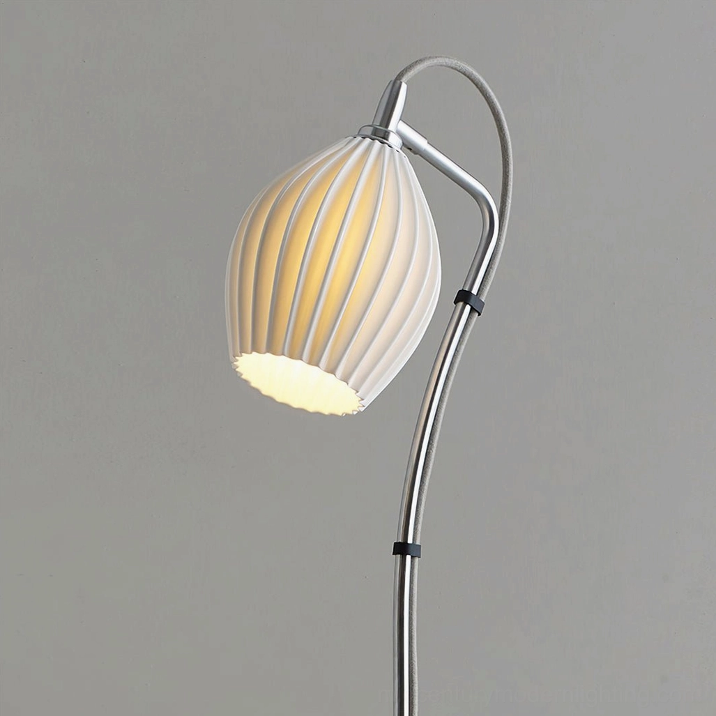 Ceramic ribbed arc floor lamp in interior design styling demonstrating versatility and artistic placement