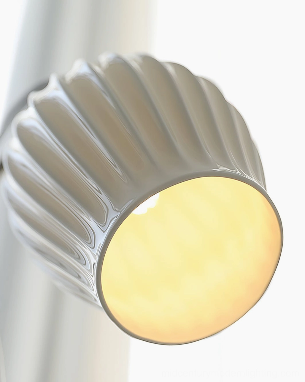 Ceramic ribbed floor lamp positioned in reading corner showcasing functional modern lighting design