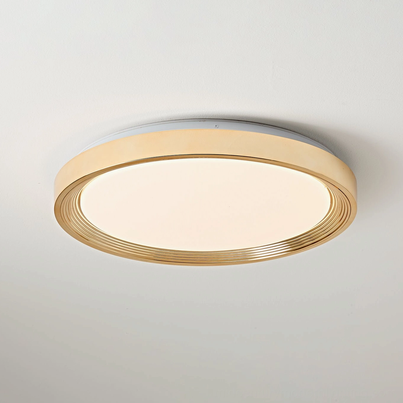 Cerova cream-colored LED ceiling light with warm ambient illumination in bedroom