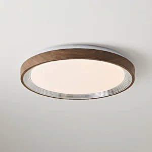 Close-up detail of Cerova ceiling fixture showing ribbed metallic inner trim and wood grain outer frame