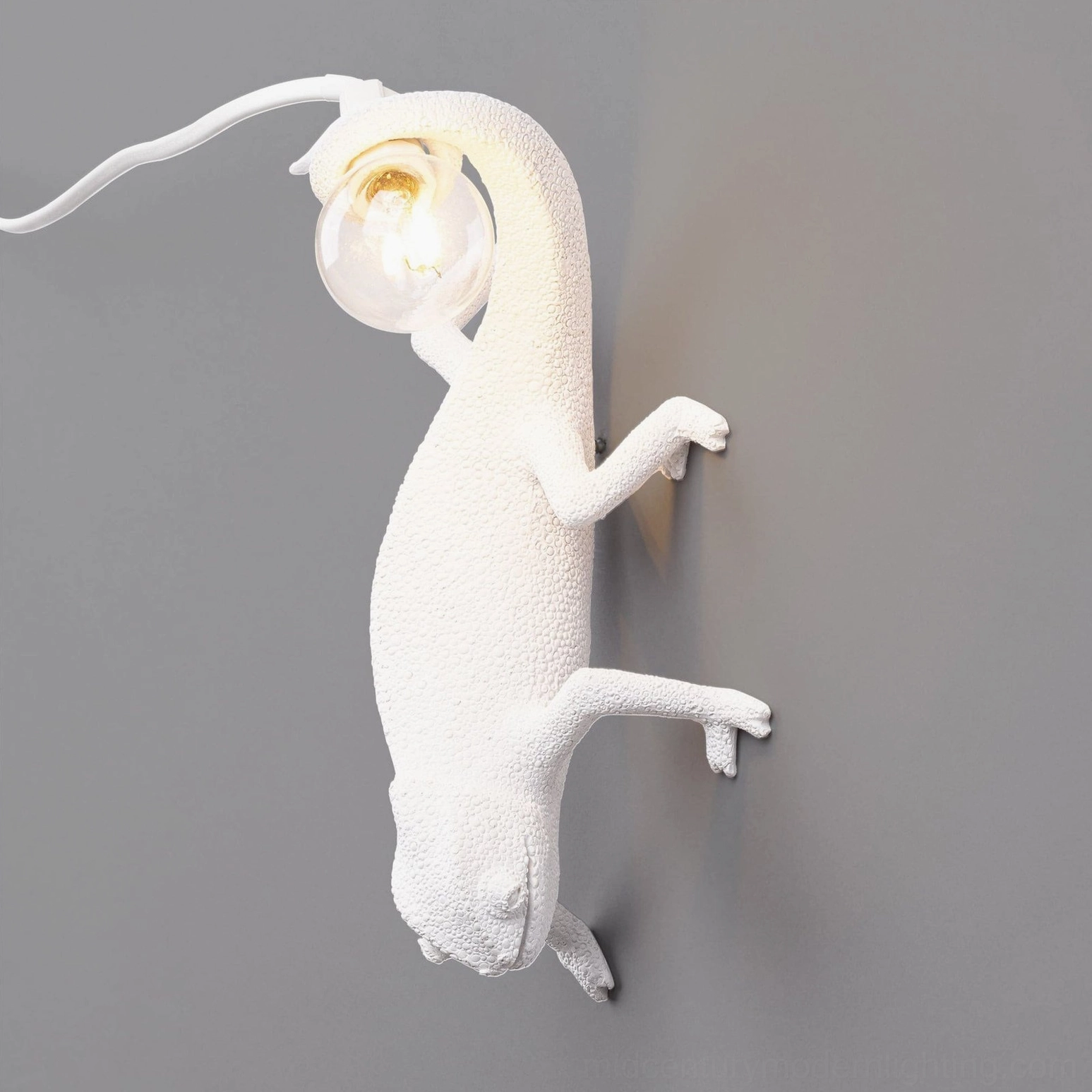 Chameleon wall lamp ascending pose sculptural form, premium resin construction