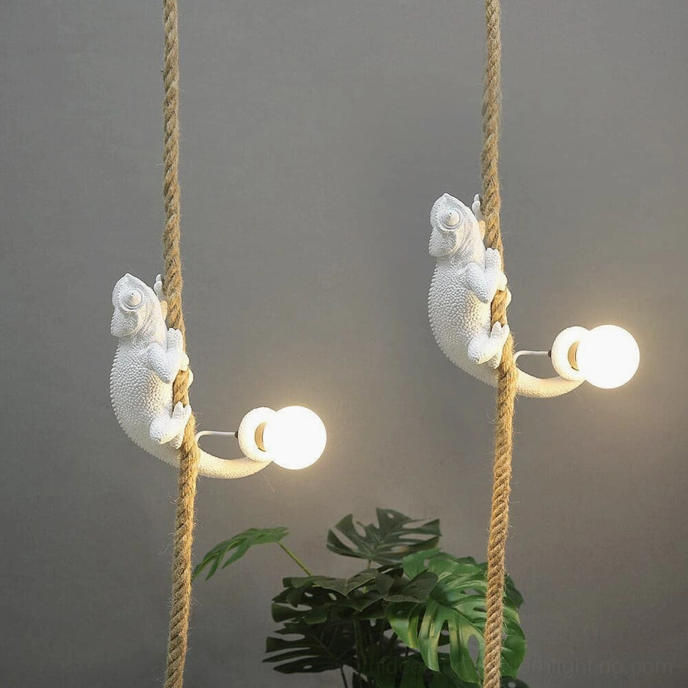 Chameleon wall light fixture showing anatomical detail and warm glow, artistic lighting sculpture