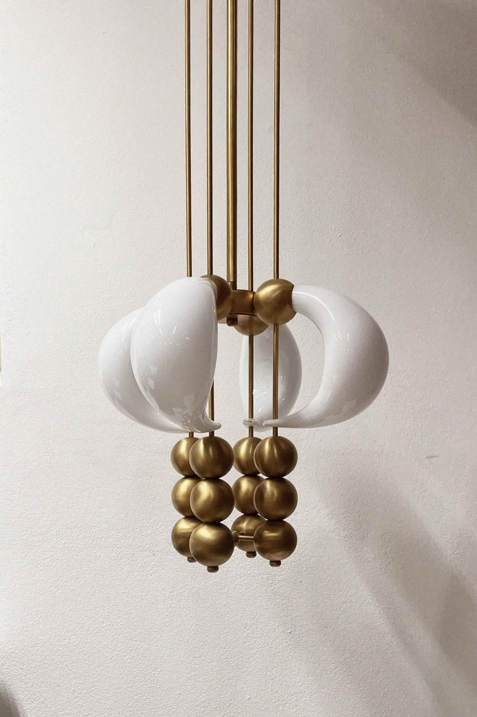 Champagne gold brass spherical beads accent curved white opal glass pendant chandelier - luxury modern lighting detail