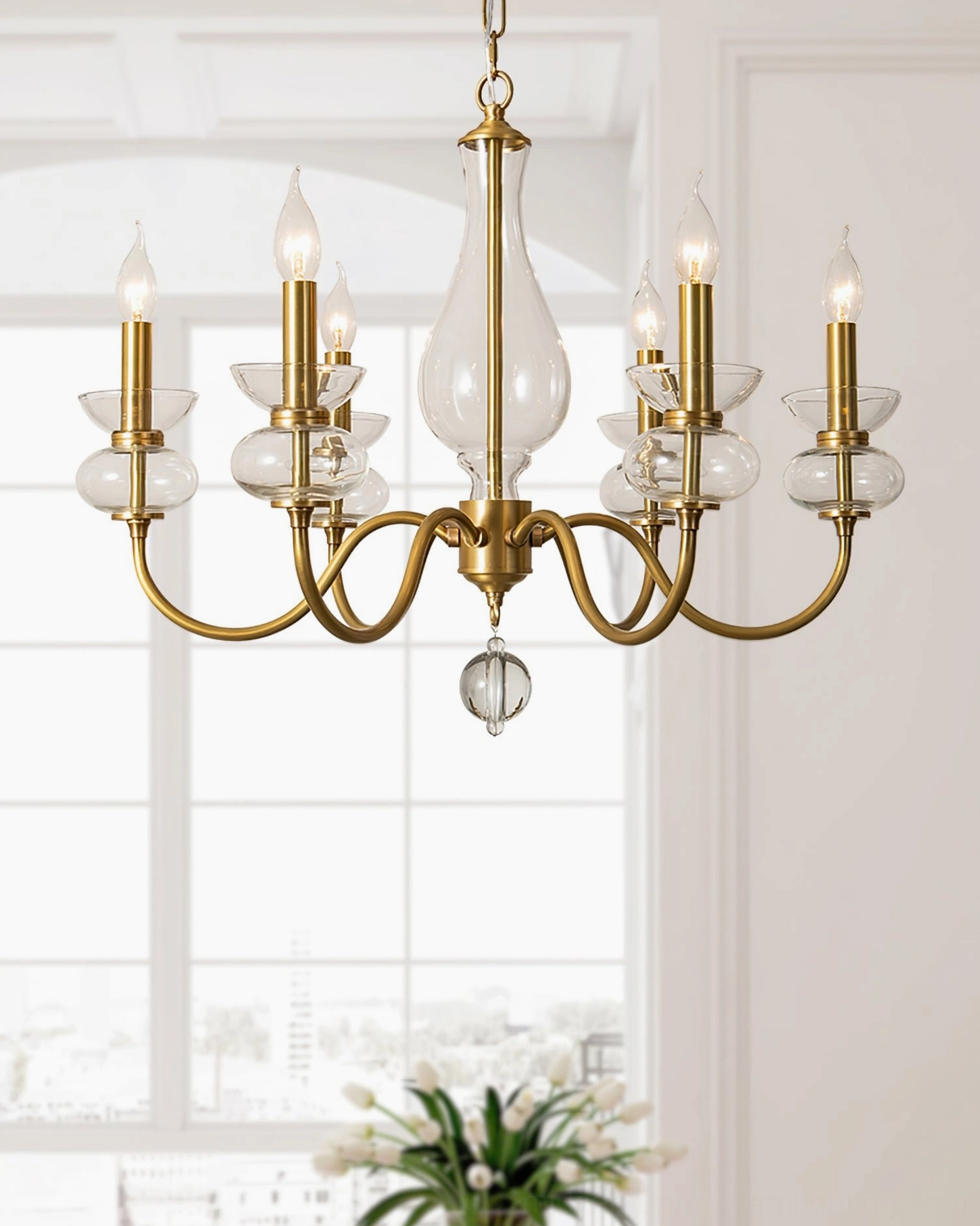 Brass glass chandelier sunlit living room vintage style multi-arm frame natural light