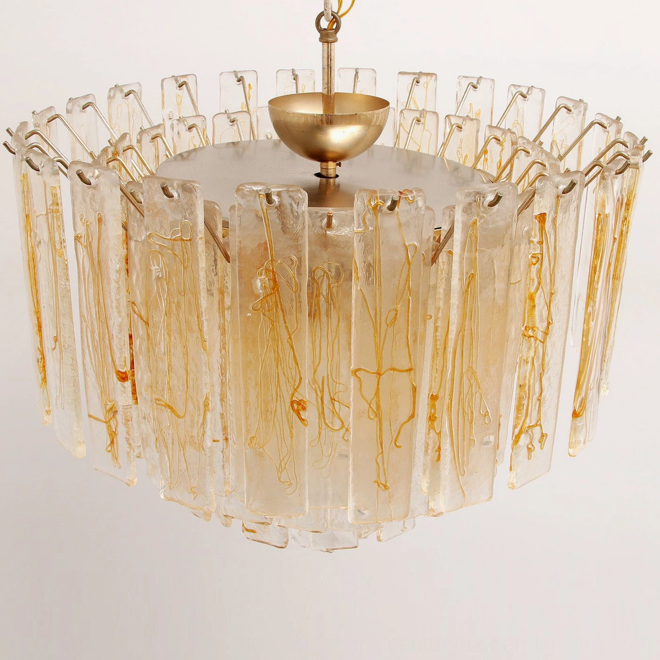 Top-down overhead view of chandelier showing circular metal top frame and brass center mounting hardware