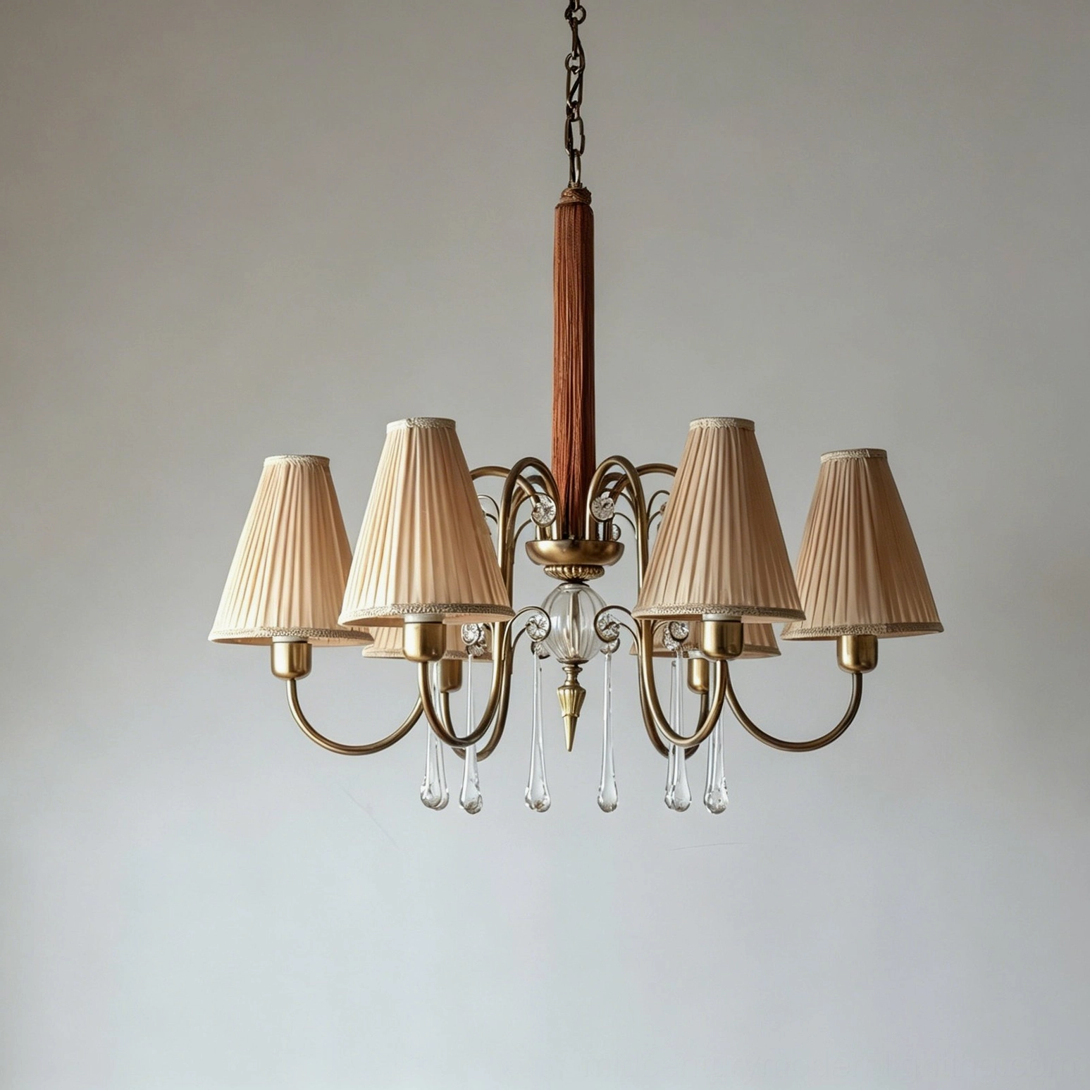 Chateaux Crystal Chandelier with empire fabric shades installed as focal point in elegant high-ceiling dining room interior