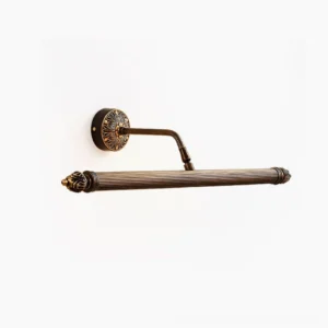 Chatsworth Acanthus brass wall sconce with carved floral backplate and ribbed cylindrical shade, studio side-front view
