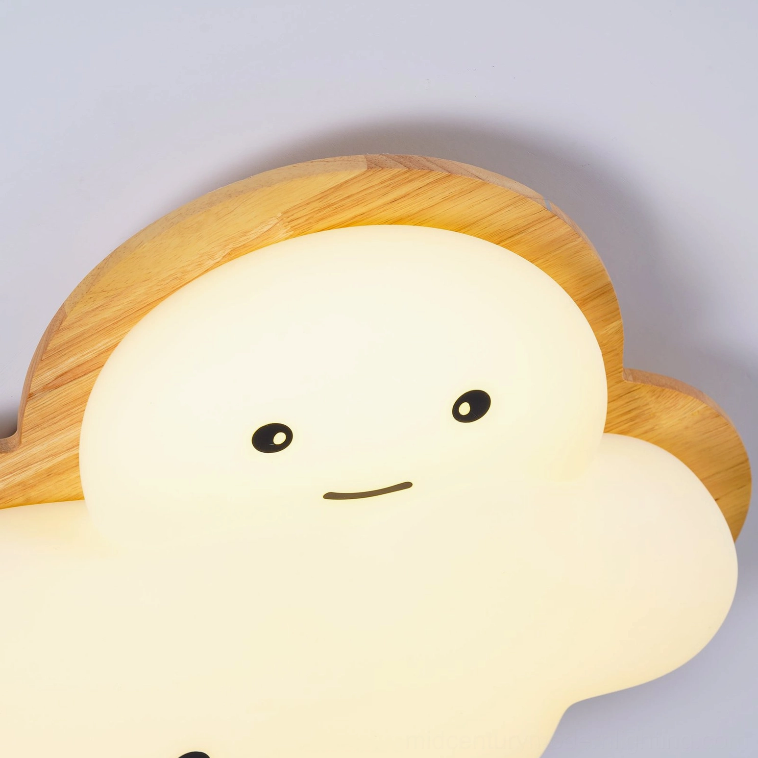 Cheerful smiling cloud ceiling lamp in modern kids room with creative play space and soft lighting
