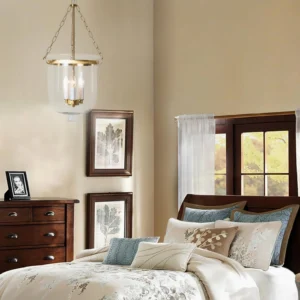 Chelsea pendant lamp hanging above master bedroom bedside, warm brass and glass creating intimate bedroom lighting
