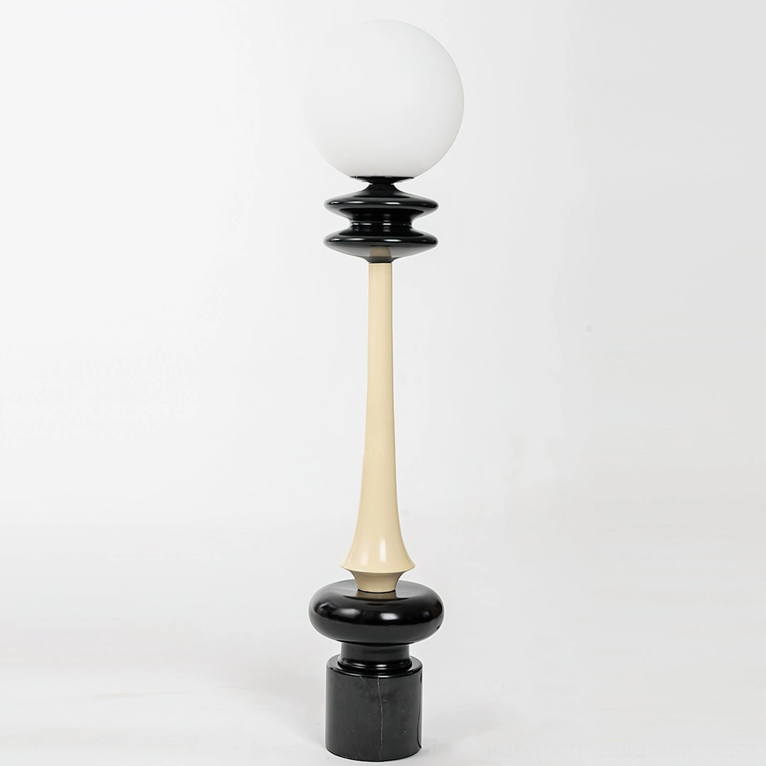 Chess floor lamp with polished layered decorative black base and frosted sphere diffuser