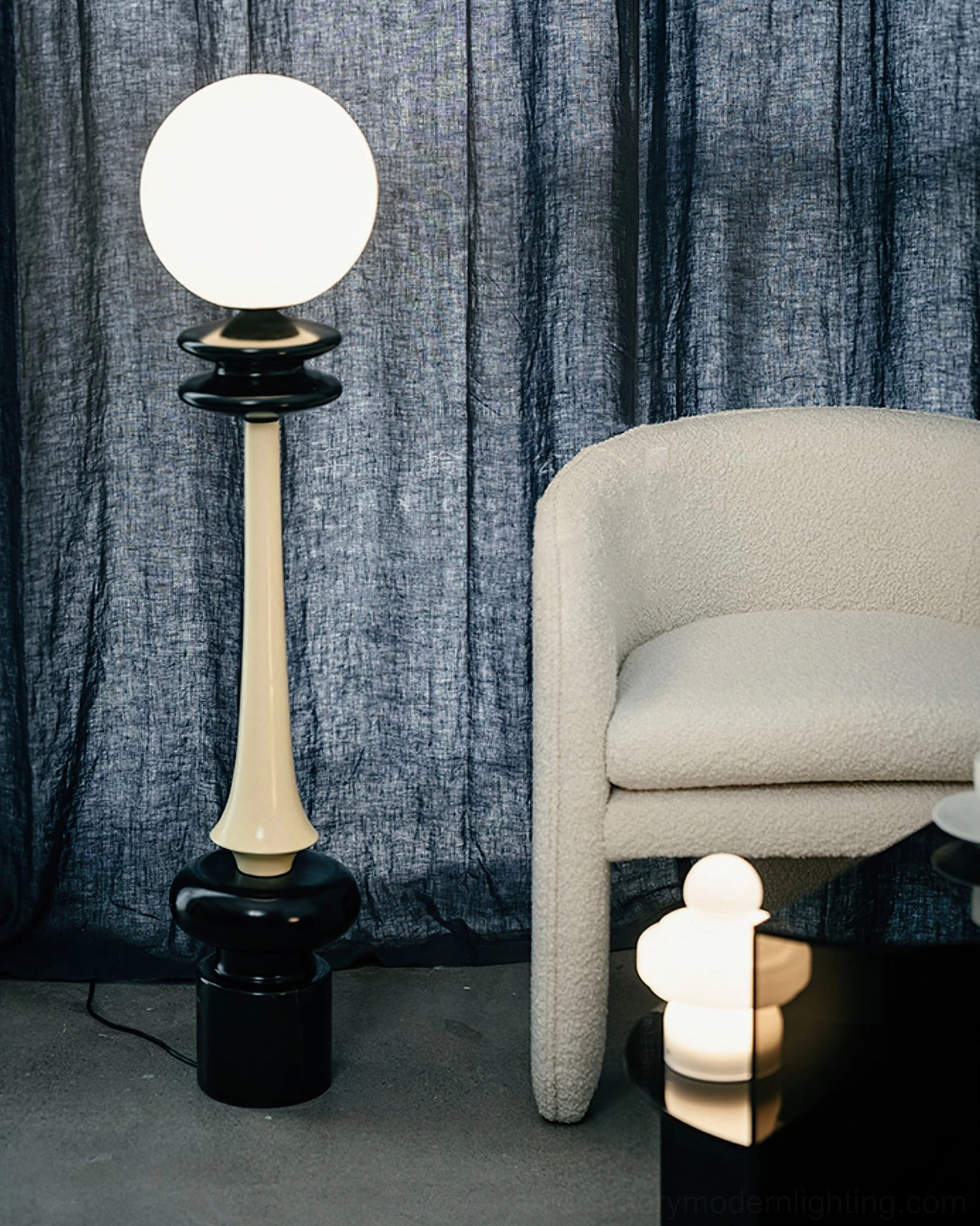 Chess floor lamp side view in minimalist living room with linen armchair and dark curtains