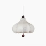 Chestnut scalloped fabric pendant lamp front view with rose line art prints and dark wood finial detail