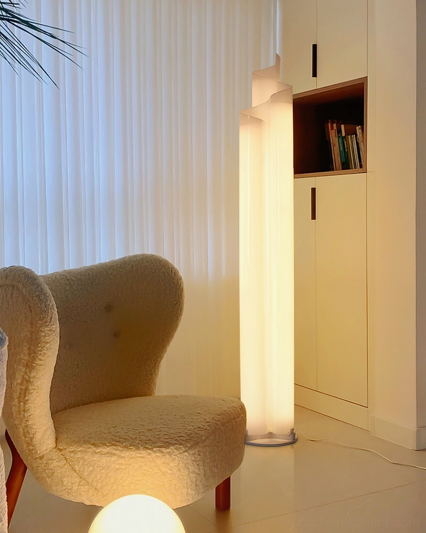 Chimera floor lamp warm glow modern living room with tufted chair mid-century interior