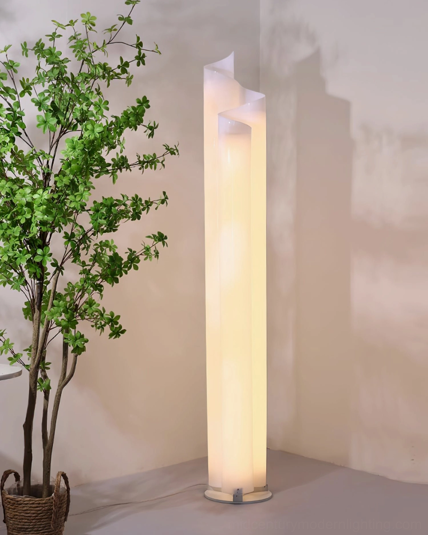 Chimera spiral floor lamp glowing warm light low angle view with potted plant