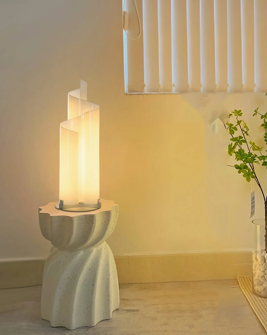 Lit chimera spiral lamp in warm bedroom corner on carved stone side table with window blinds eye-level perspective