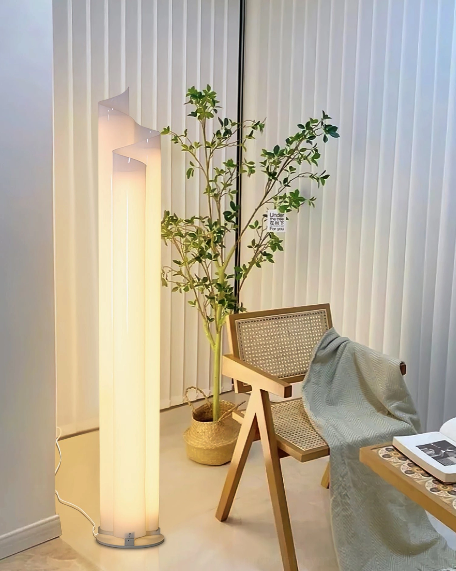 Chimera floor lamp in reading nook with rattan chair cozy minimalist atmosphere