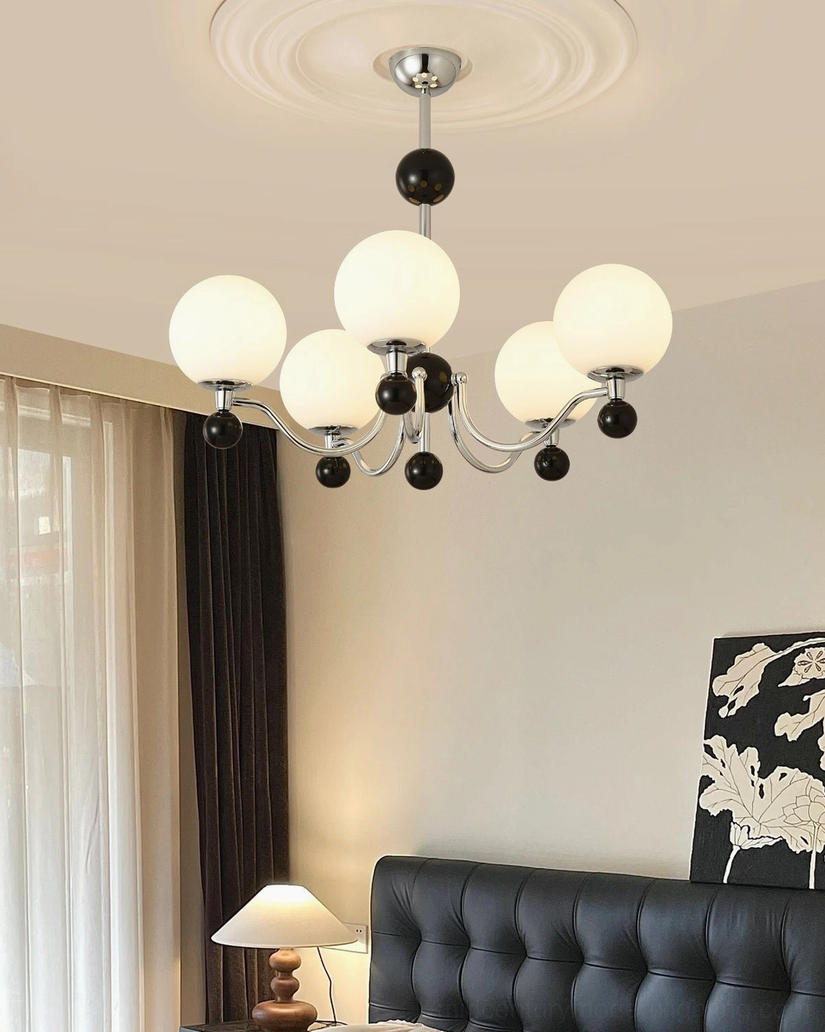 Modern chrome chandelier with spherical frosted glass shades in minimalist interior design