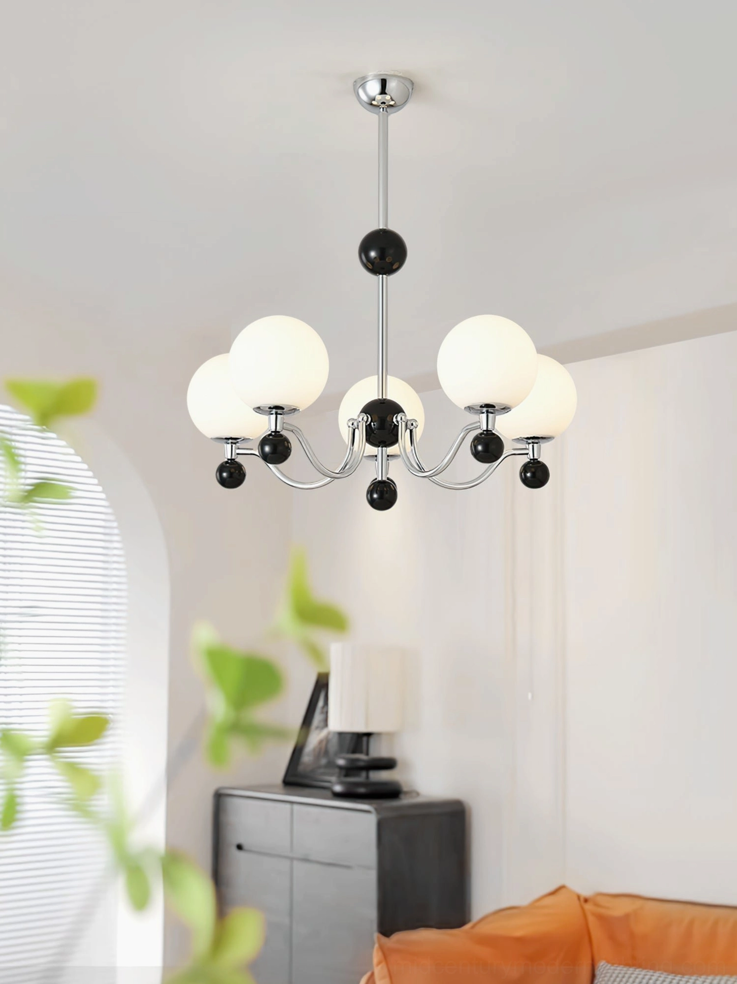 Contemporary black and white chrome chandelier in Nordic style living room setting