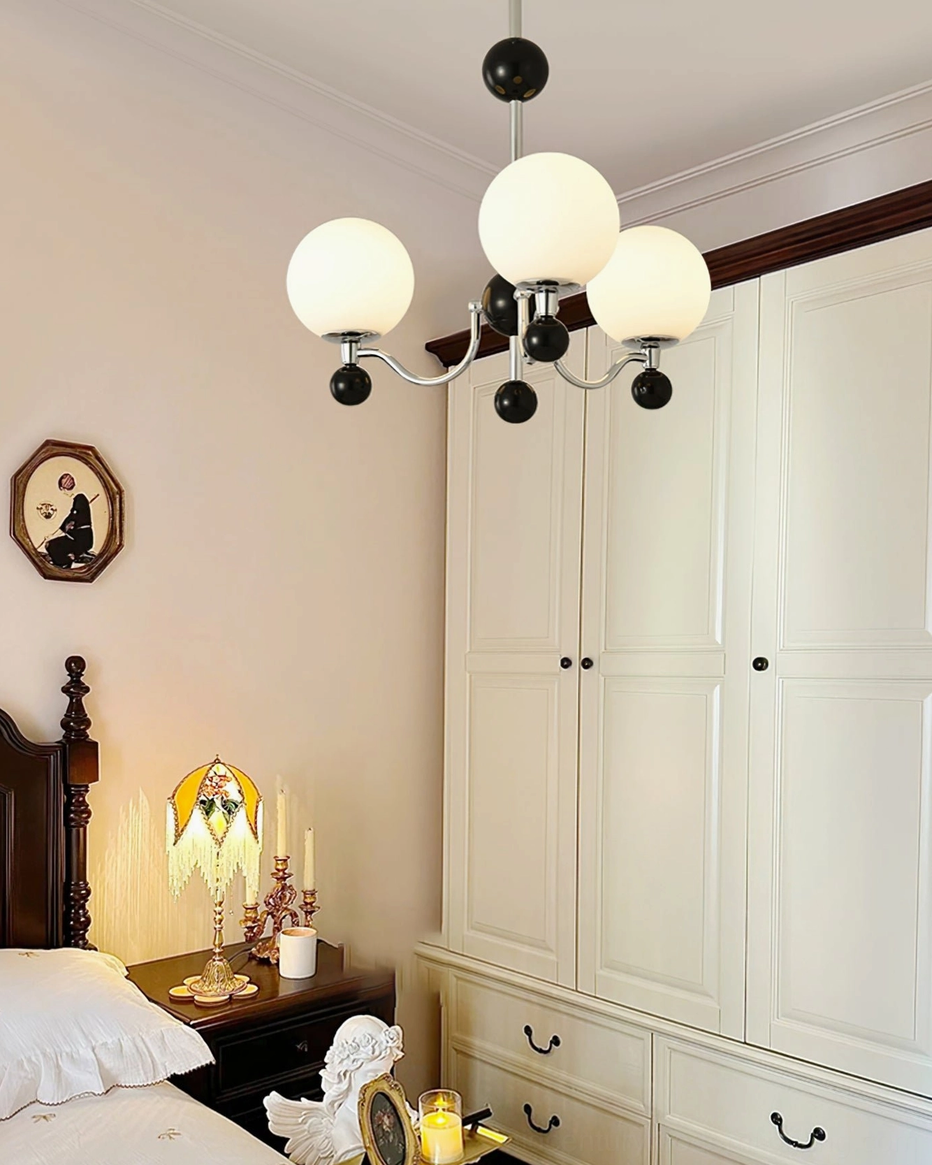 Polished chrome multi-head chandelier in vintage-inspired bedroom interior