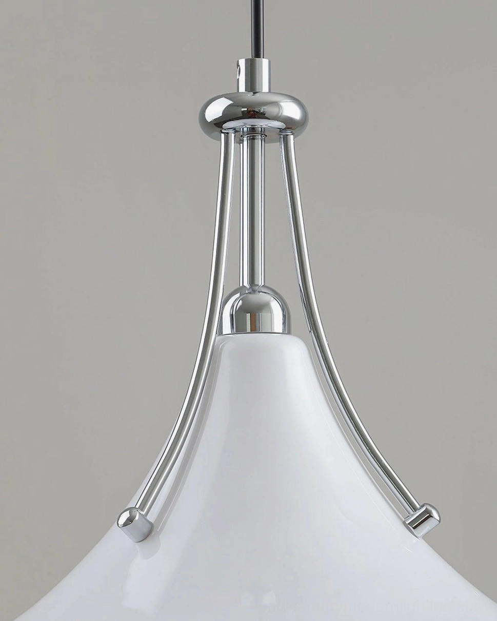 Top-down close-up of polished chrome metal fixtures and articulated swing arm joints, showing precision engineering and hardware finish