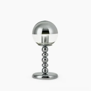 Chrome Mirrorball table lamp with half-mirrored half-clear glass sphere on beaded metal stem, studio front view