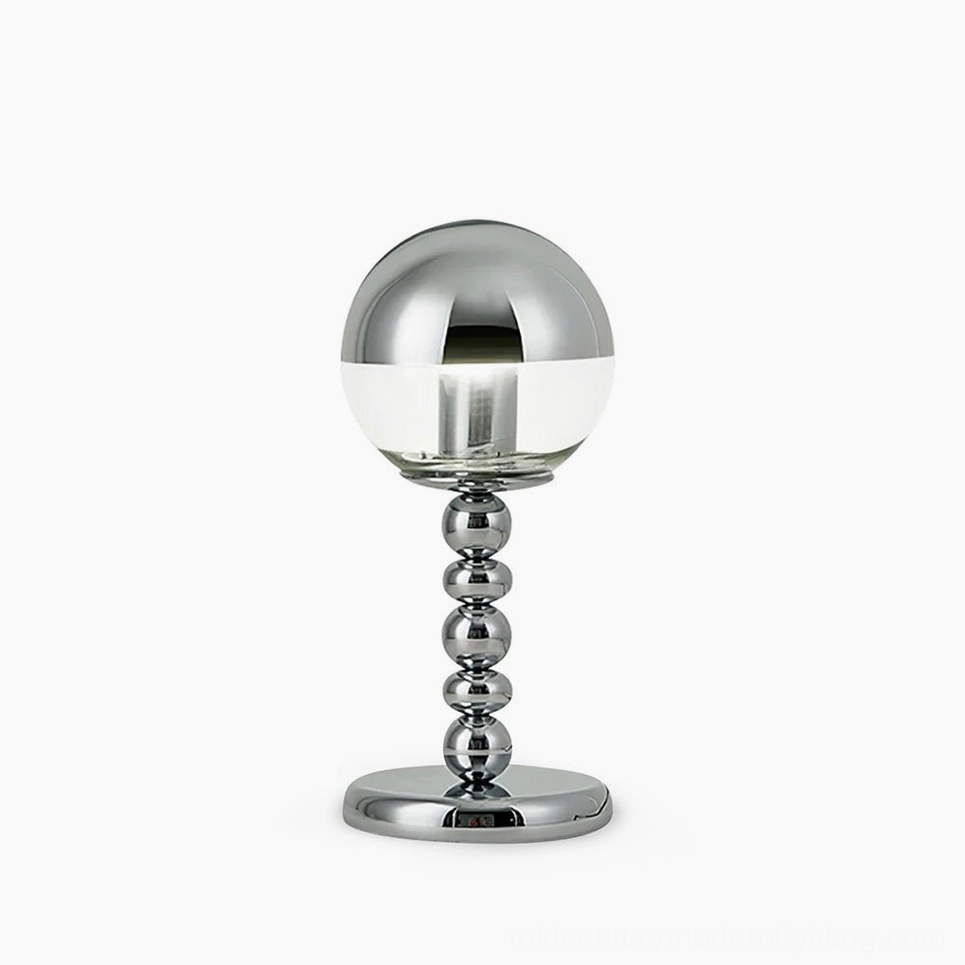 Chrome Mirrorball table lamp with half-mirrored half-clear glass sphere on beaded metal stem, studio front view