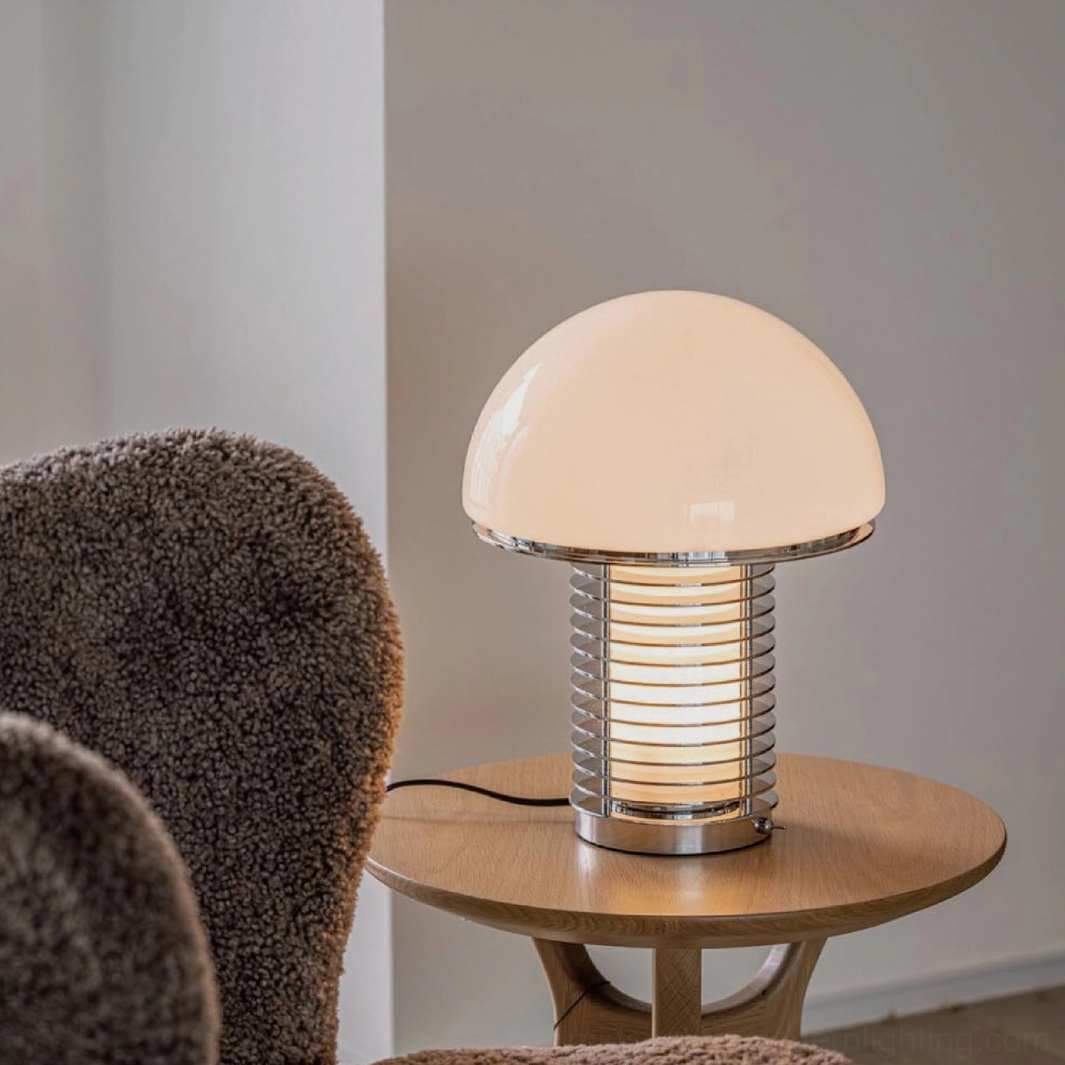 Mushroom style table lamp in living room setting on side table, three-quarter angle showing sculptural design