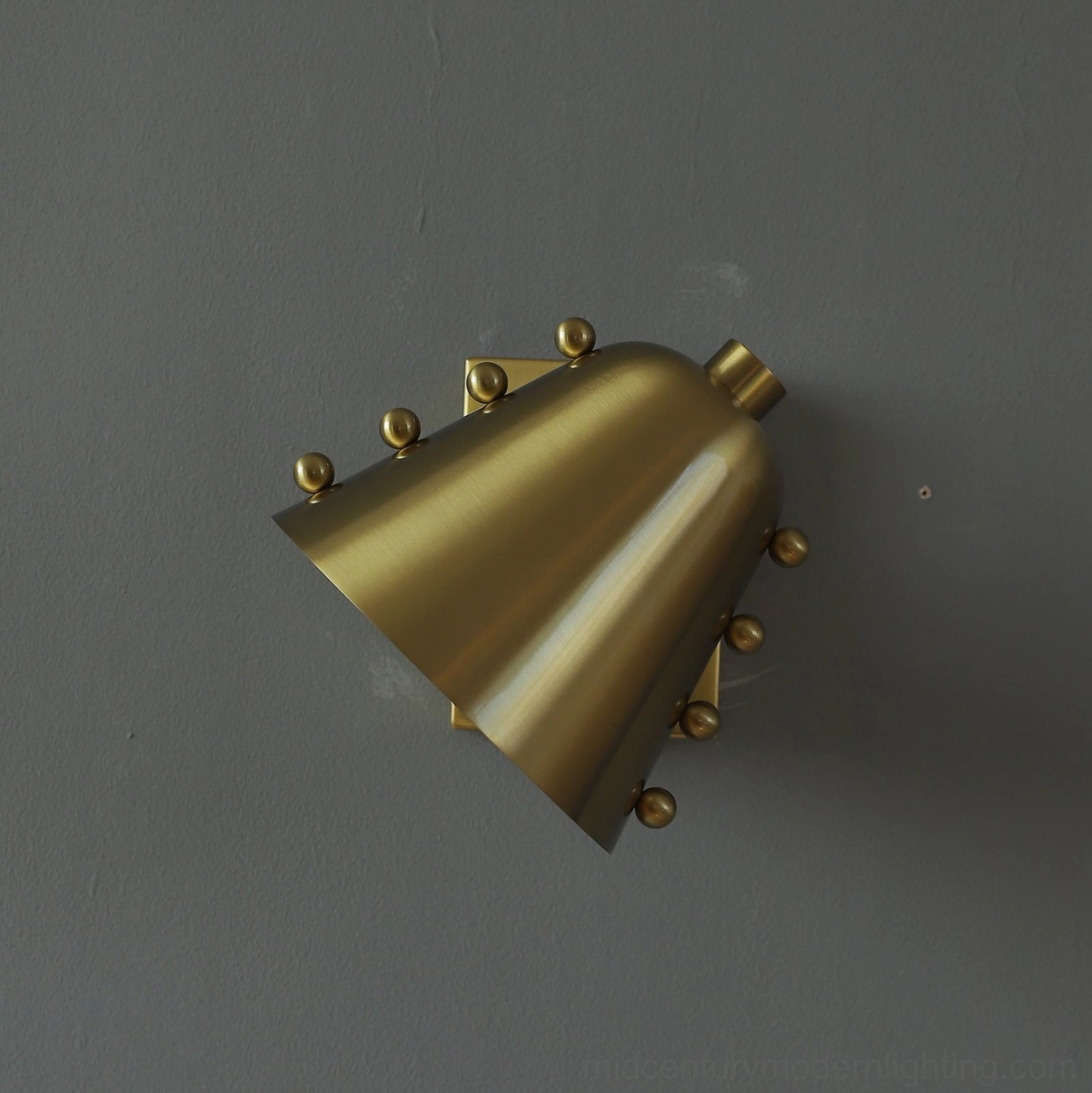 Chrome geometric wall sconce showing design versatility in modern apartment interior