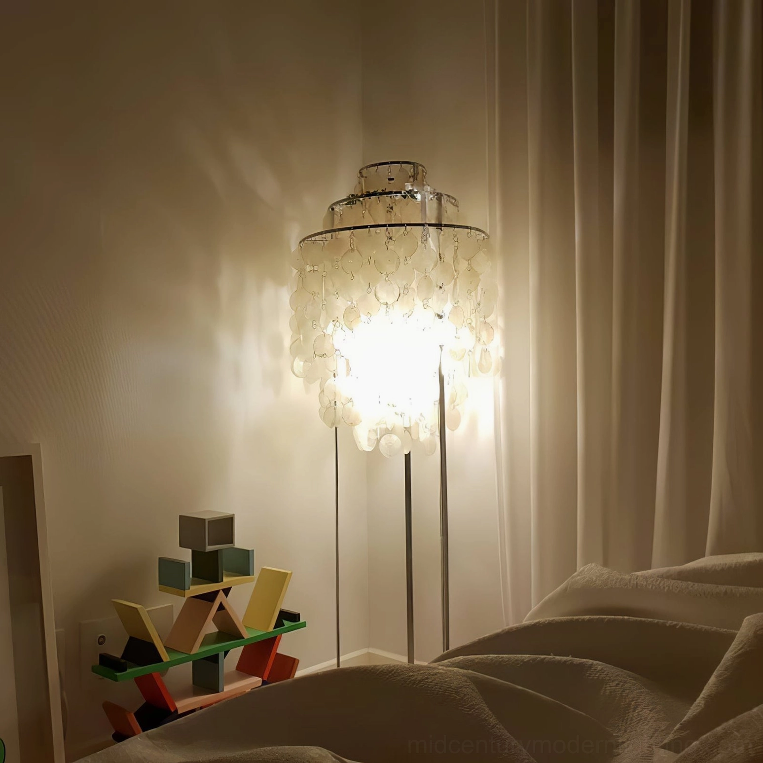 Chrome-finished mother of pearl shell floor lamp architectural lighting installation