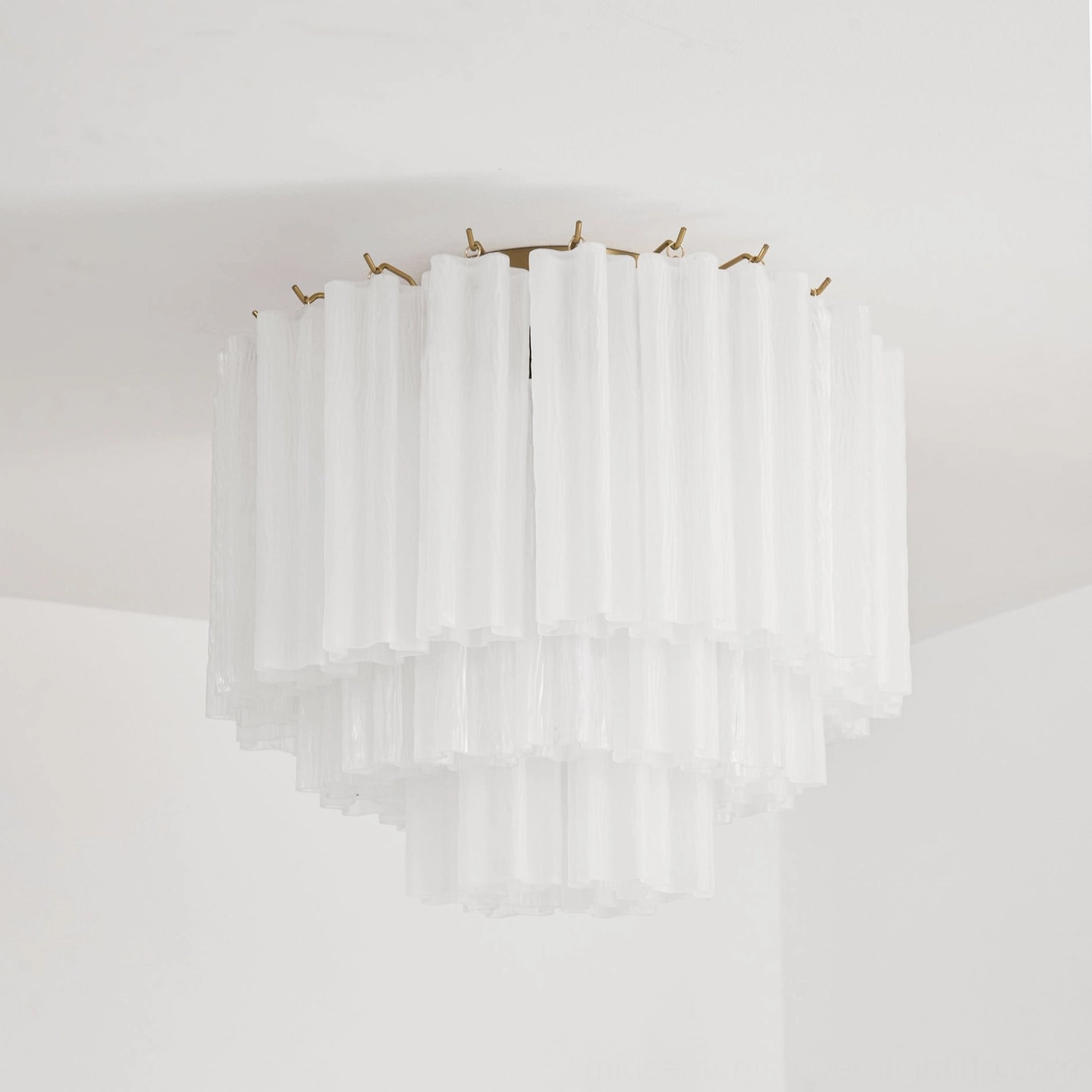 Close-up detail of Chrono Tubular Ceiling Lamp showing multi-layer fluted glass texture and brass ceiling mounting accents
