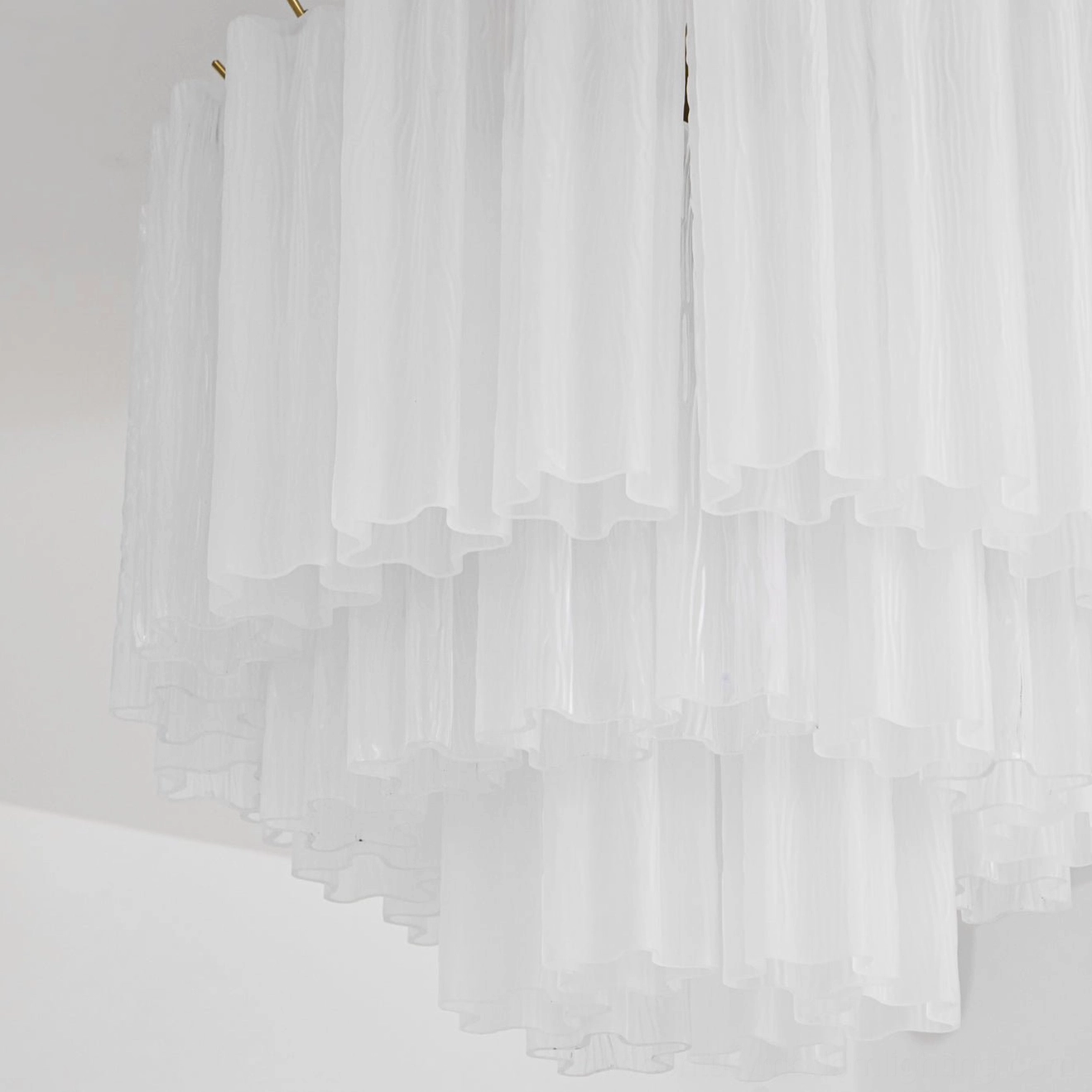 Extreme close-up macro detail of Chrono Tubular Ceiling Lamp showing soft fluted multi-tier glass texture and delicate layered structure
