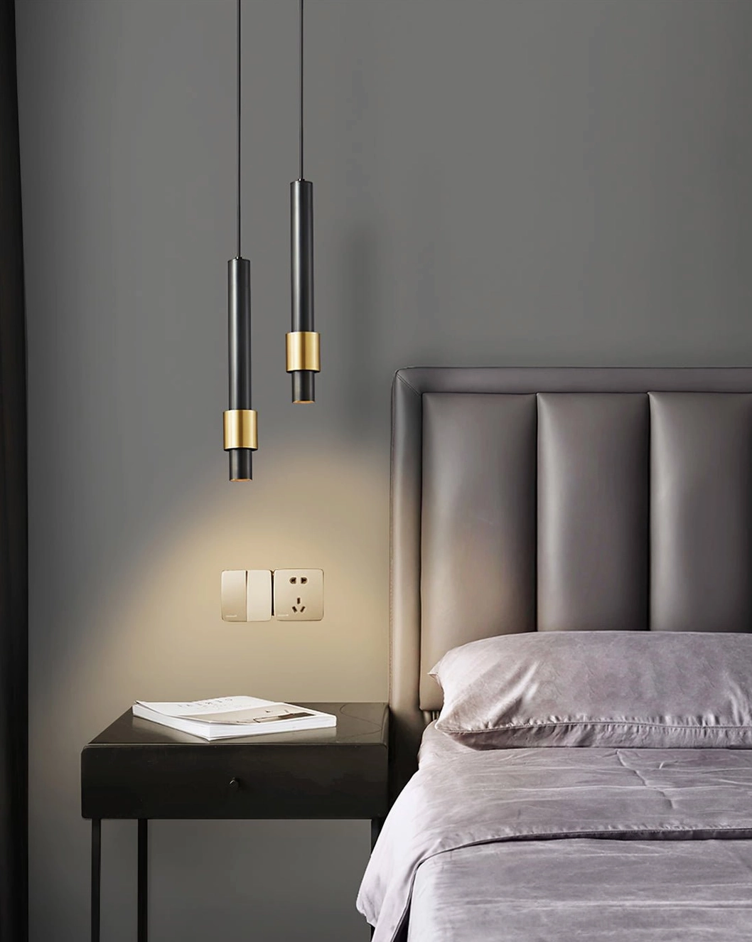 Twin Cicada LED pendants in luxury bedroom with tufted headboard, contemporary accent lighting design