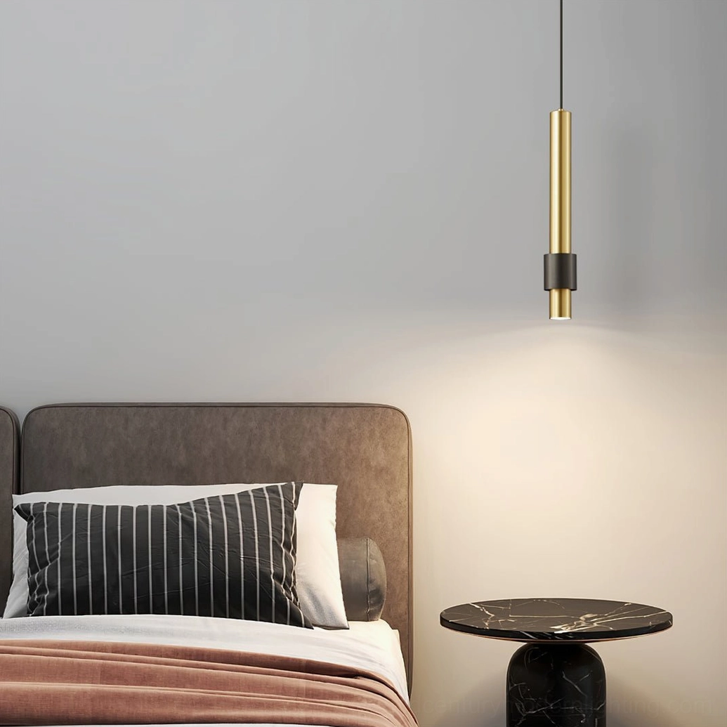 Cicada gold-toned LED pendant with black base creating warm spotlight effect in modern bedroom