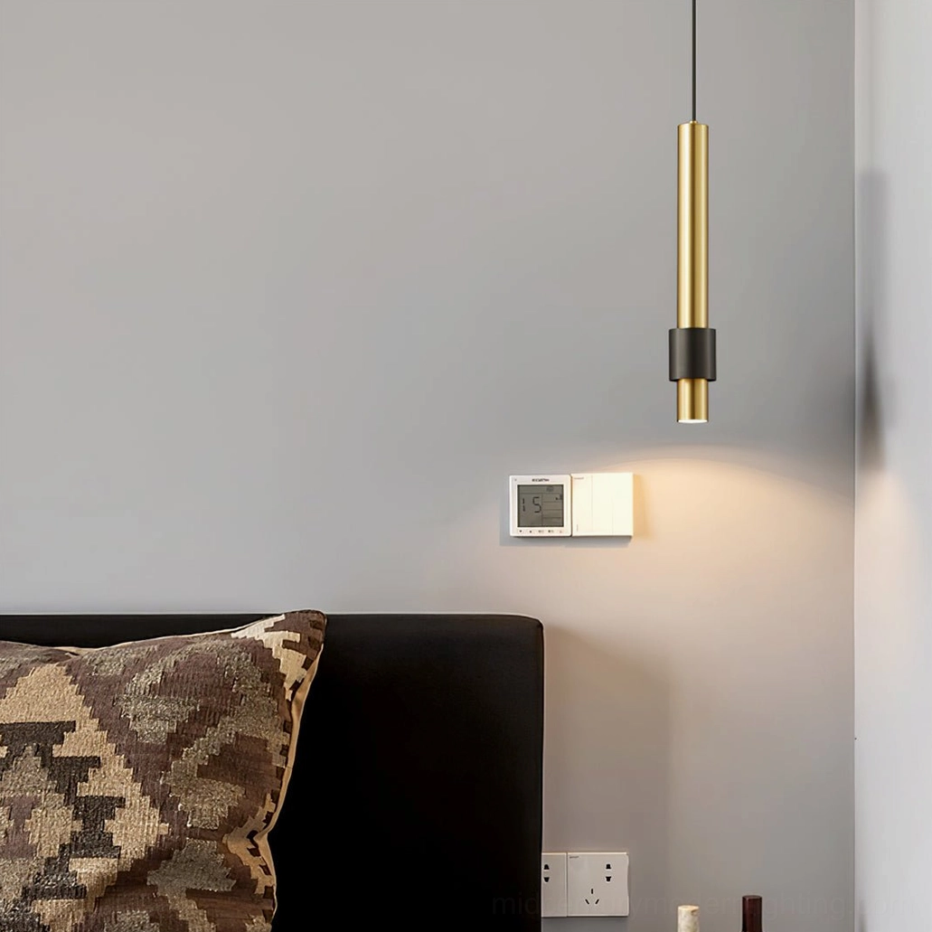 Minimalist dual-tone Cicada pendant lamp near wall switch panel, contemporary cylindrical metal fixture
