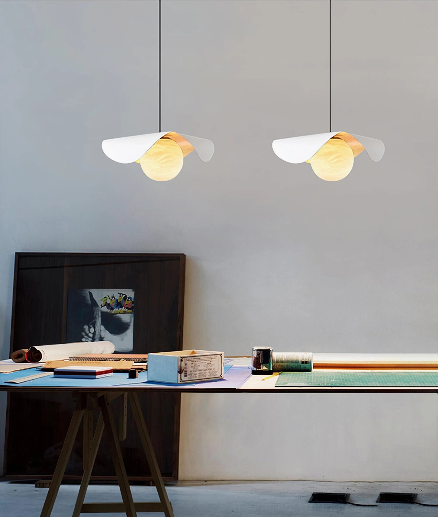 Cilla asymmetrical pendant lamp installed in contemporary interior, black and gold pendant light design, functional task lighting