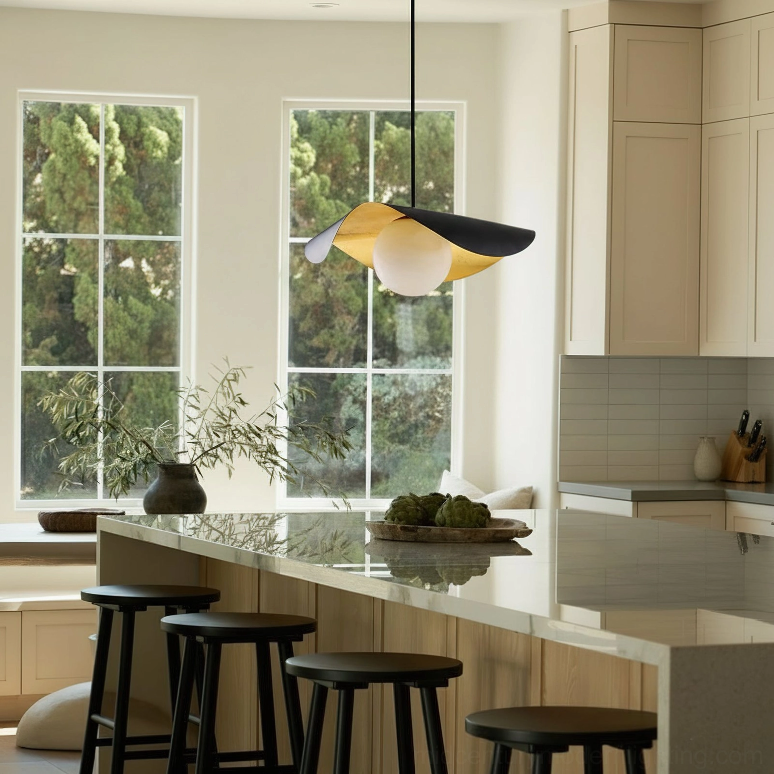 Single Cilla pendant lamp suspended above kitchen countertop, bright interior with floor-to-ceiling windows, modern asymmetrical pendant design