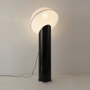 Ciot sculptural floor lamp illuminated with black metal base and luminous white acrylic shade