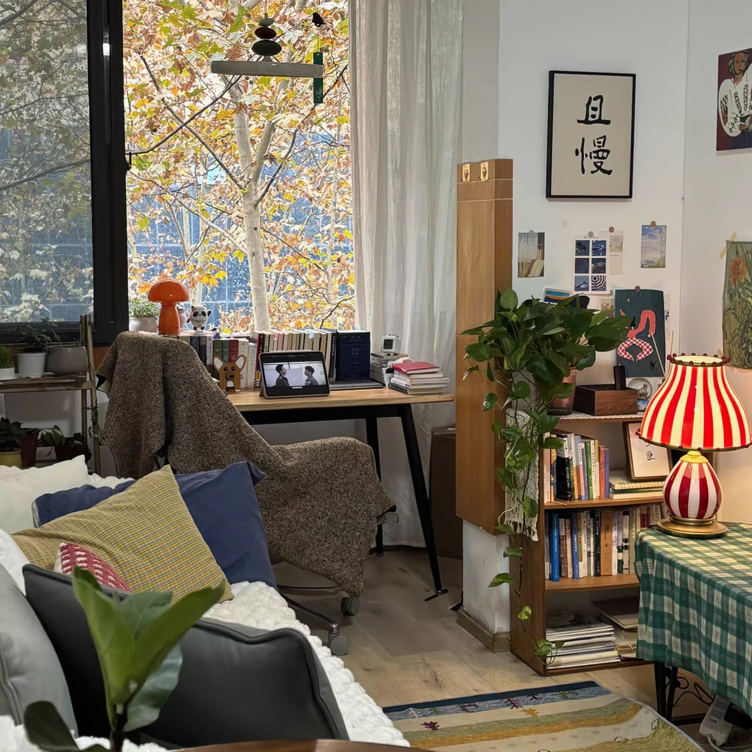 Striped carnival table lamp as focal point in contemporary bohemian bedroom
