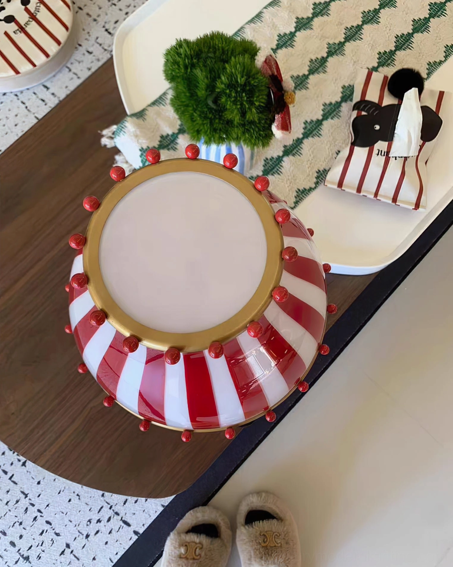Vintage circus striped table lamp on credenza with mid-century modern accessories