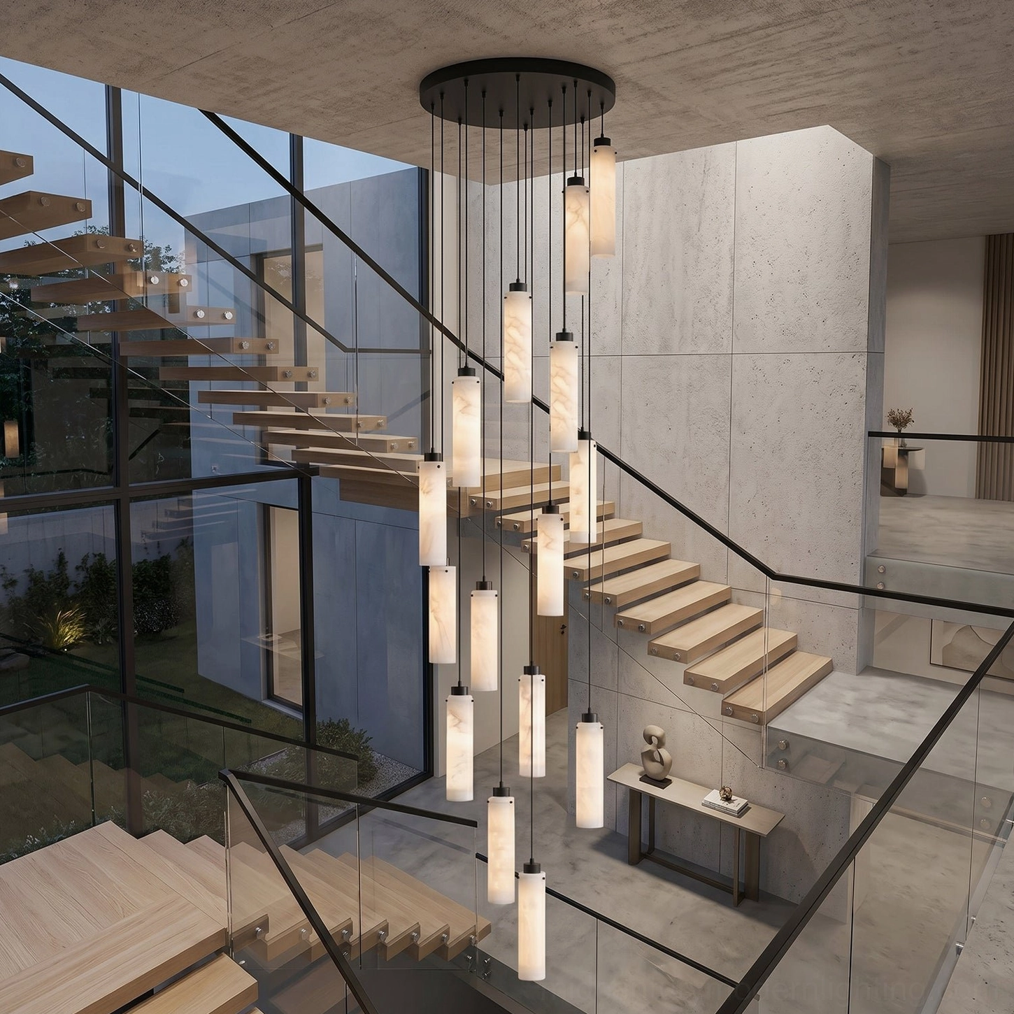 Cirio multi-pendant chandelier installed in modern double-height stairwell with warm alabaster glow