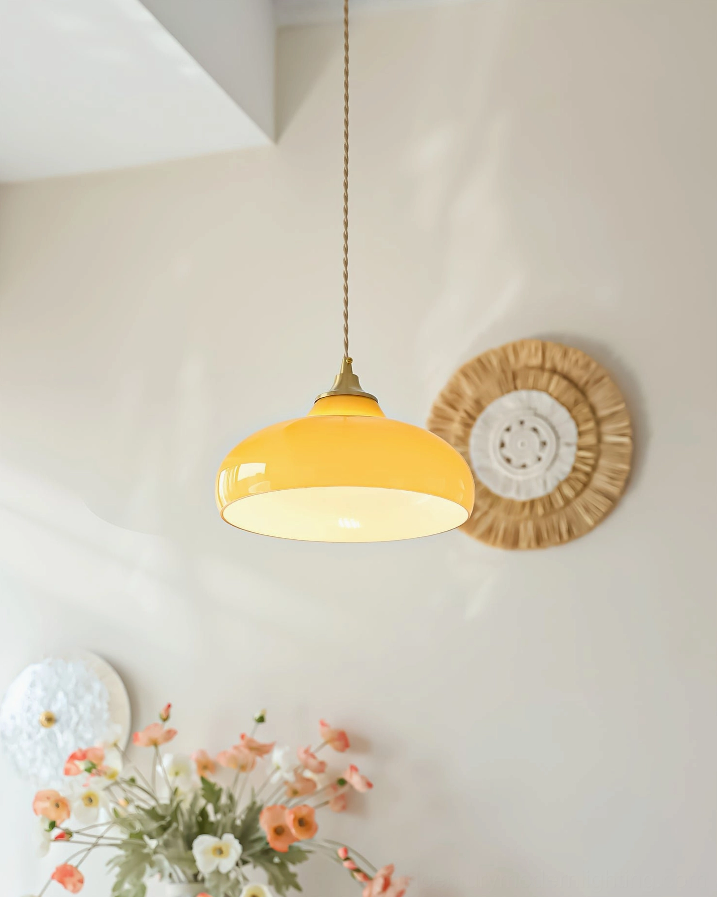 Citrine dome pendant illuminated overhead view in warm home lighting with floral and textile decor